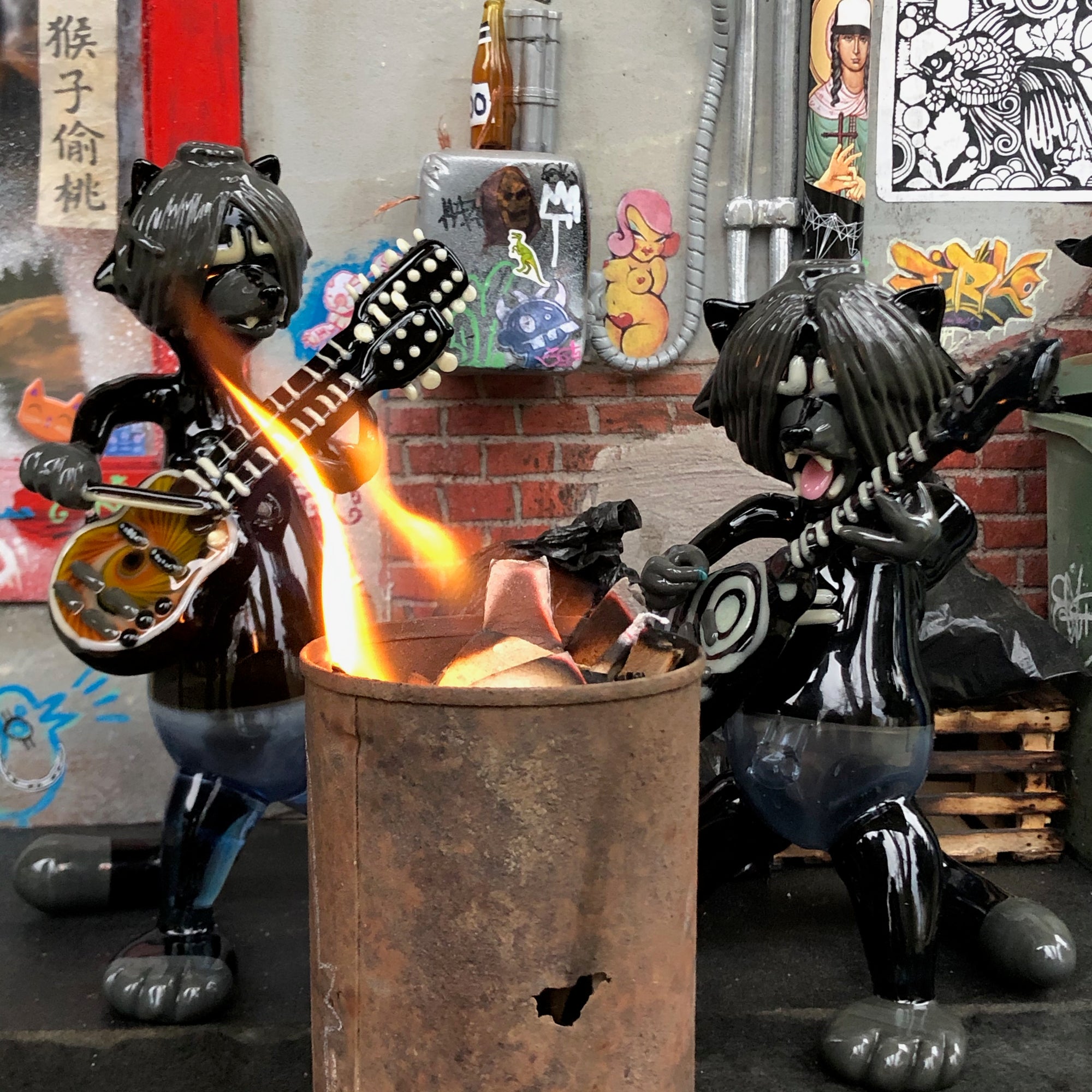 Racoon Death Metal band is shown among R3G15 Miniature alley scene, there is real fire in the model trash can in front of the musicians.