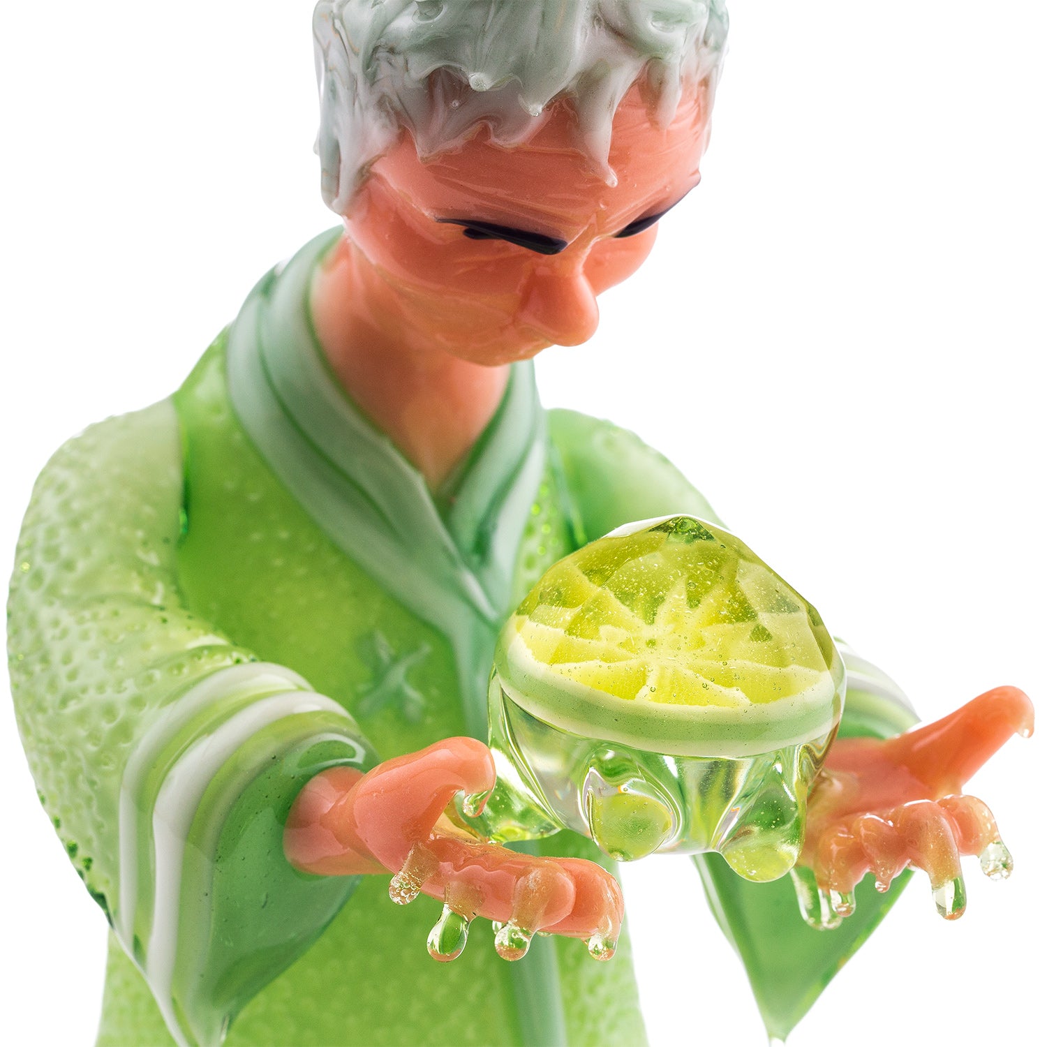 Studio Photo close up showing R3G15 glass collab with Lyons Glass, piece is a citrus monk holding a faceted Lime. 
