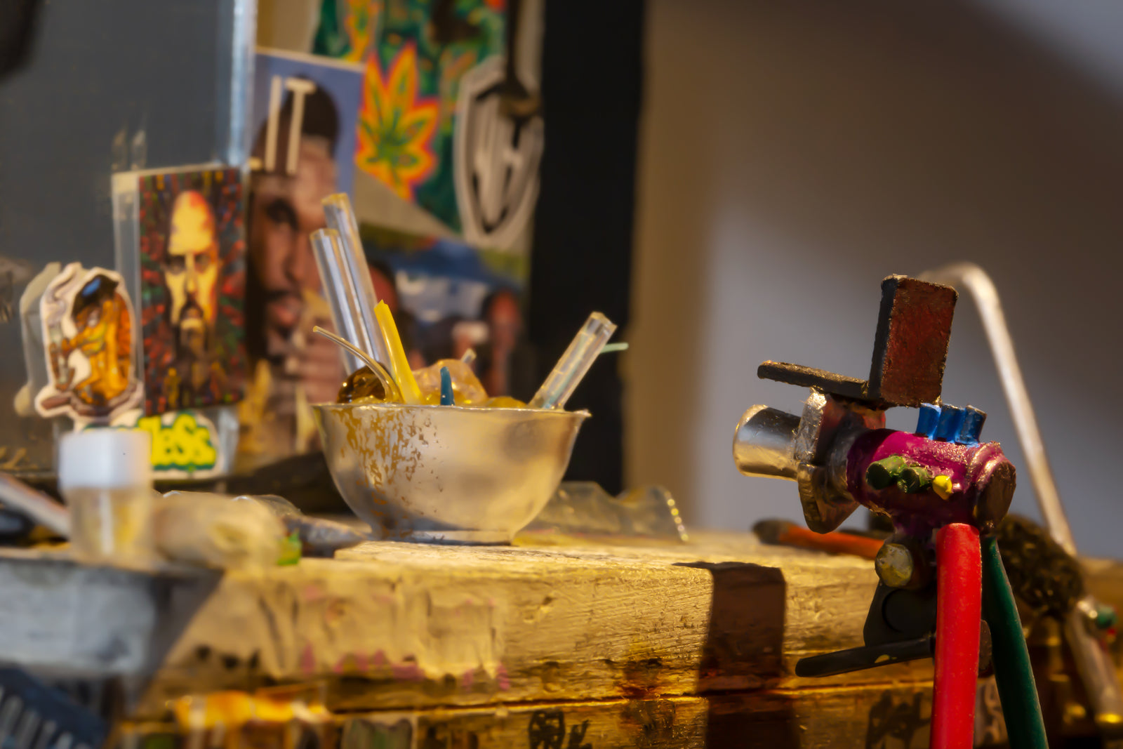 Close up photo from the left side of the glassblowing station model showing the torch and water bowl.